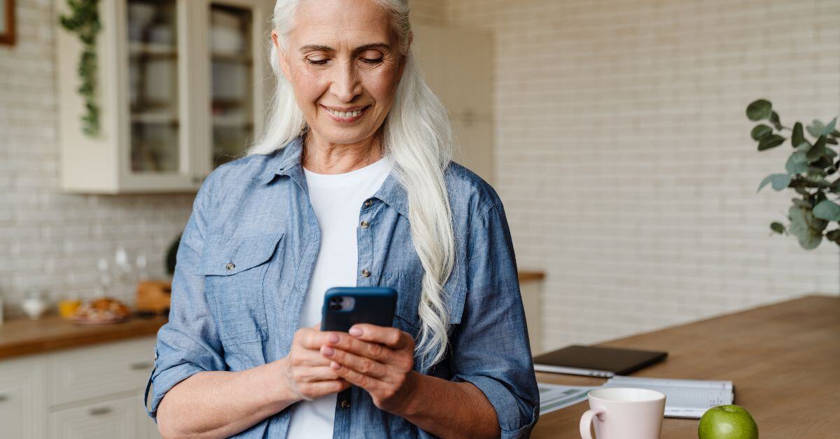 Online Portal Use by the Elderly Rising in Legal & Medical Industries Featured Image; Older Woman on Phone